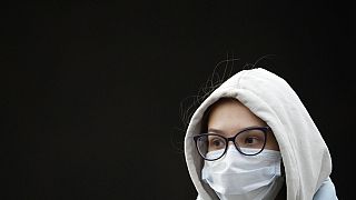 A young woman wearing a face mask to help curb the spread of the coronavirus leaves a subway in Moscow, Russia, Friday, Oct. 15, 2021.