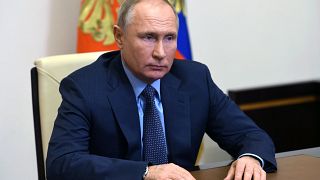Russian President Vladimir Putin listens to Russian gas monopoly Gazprom Head, Alexei Miller via a video conference.