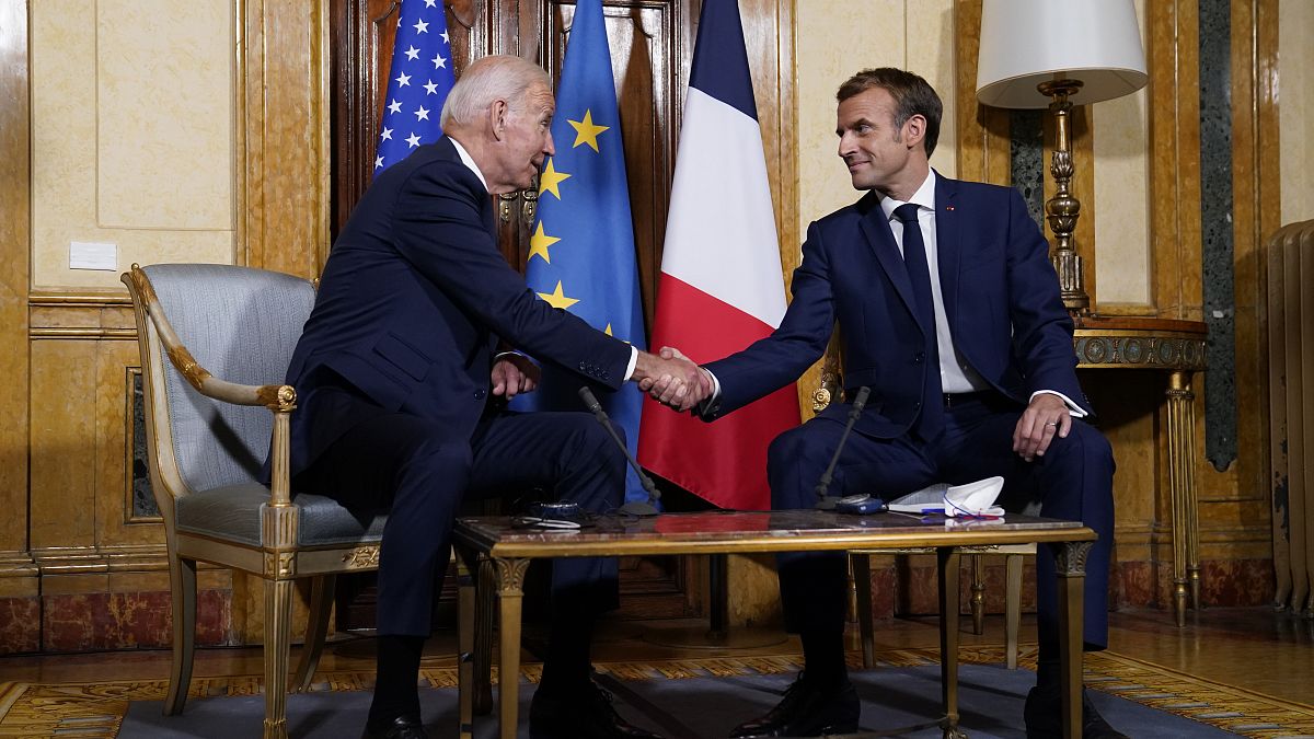 U.S. President Joe Biden, left, shakes hands with French President Emmanuel Macron during a meeting at La Villa Bonaparte in Rome, Friday, Oct. 29, 2021.