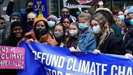 Climate activist Greta Thunberg, centre, demonstrates with others in London ahead of COP26.