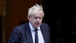 FILE: Boris Johnson leaves 10 Downing Street to attend the weekly Prime Minister's Questions at the Houses of Parliament, in London, Wednesday, Oct. 20, 2021.