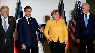 British Prime Minister Boris Johnson, French President Emmanuel Macron, German Chancellor Angela Merkel, and U.S. President Joe Biden at the G20 summit in Rome.