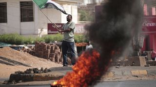Sudanese protesters take to the streets against bloody coup
