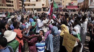 People chant slogans during a protest in Khartoum, Sudan, Saturday, Oct. 30, 2021