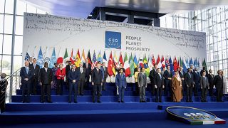 Leaders pose for the family photo of the G20 summit at the La Nuvola conference center, in Rome, Saturday, Oct. 30, 2021.