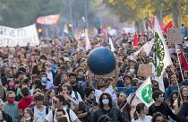 Demonstrators march in Rome, Saturday, Oct. 30, 2021, the day a Group of 20 summit started in the Italian capital.