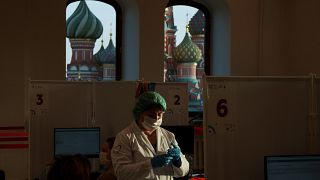 A medical worker prepares a COVID vaccine shot in view of Moscow's Red Square