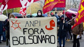 Italian Partisans Association activists march with a banner reading "Bolsonaro out".