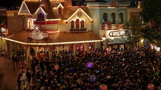 Visitors gather to wait for the COVID-19 test at the Shanghai Disney Resort