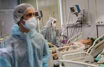 Medical staff in special suits treat a COVID-19 patient at the Infectious Hospital No. 23 in Nizhny Novgorod.