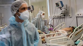 Medical staff in special suits treat a COVID-19 patient at the Infectious Hospital No. 23 in Nizhny Novgorod.