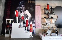 A collection of Amy Winehouse dresses and her drum set are displayed at Julien's Auctions in Beverly Hills, California.