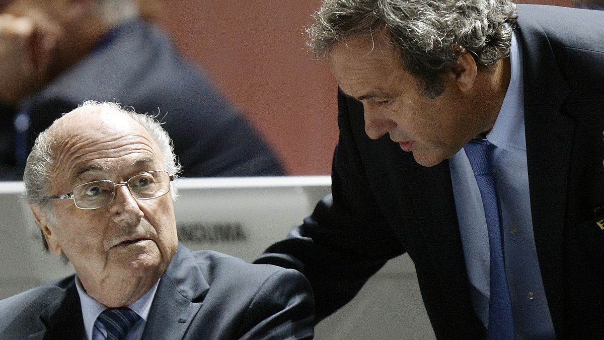 FIFA President Sepp Blatter, left, and UEFA President Michel Platini are engaged in conversation during the 65th FIFA Congress in Zurich, Switzerland, May 29, 2015. 