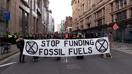 Extinction Rebellion group protests outside JP Morgan in Glasgow