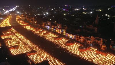 People light lamps on the banks of the river Saryu in Ayodhya, India, Wednesday, Nov. 3, 2021. 
