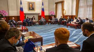 Taiwan's President Tsai Ing-wen, center right talks with Raphael Glucksmann
