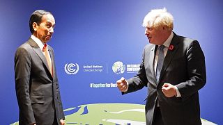 Britain's Prime Minister Boris Johnson greets Indonesia's President Joko Widodo.