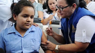 Many children around the world - including this girl in Honduras - are now vaccinated against the cancer-causing human papillomavirus (HPV)