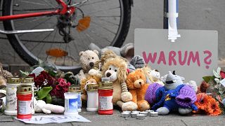 Tributes at the apartment building in Solingen where five children were found dead.