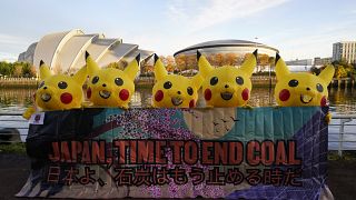 Japanese protestors dressed as Pikachu have taken to the streets of Glasgow to call on Japan to ditch fossil fuels.