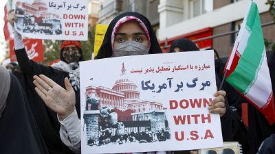 Iranian protesters raise anti-US placards during a rally outside the former US embassy in the capital Tehran.