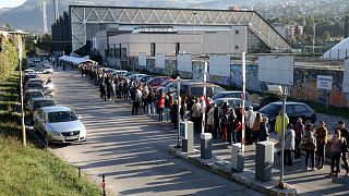 People wait in lines to get a vaccine in Sarajevo, Bosnia, Saturday, Sept. 25, 2021.