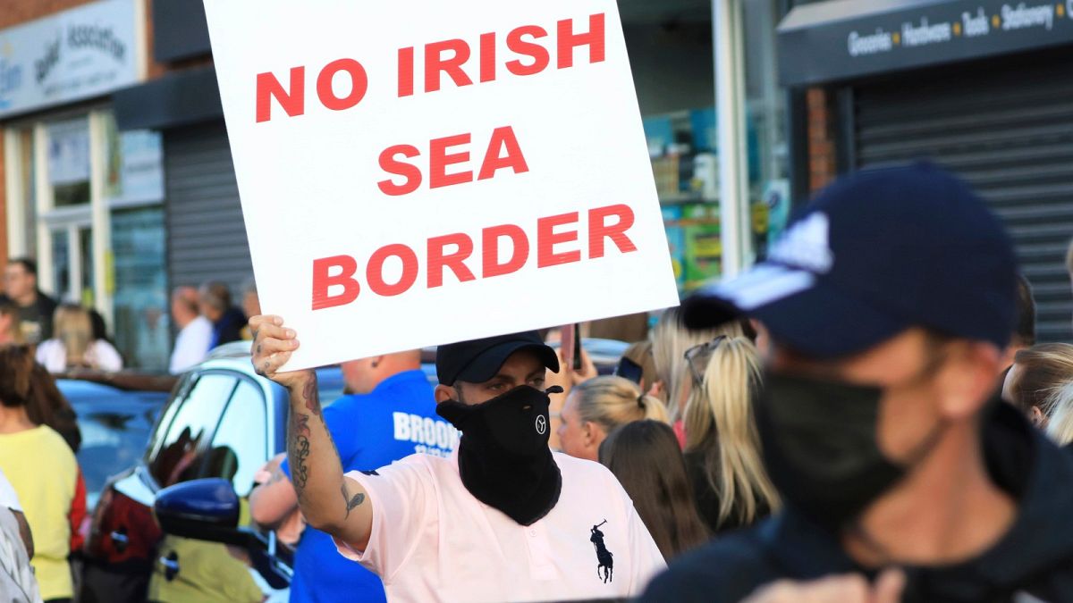 Loyalists opposed to the Northern Ireland Protocol protest in Newtownards town centre, Northern Ireland, Friday, June 18, 2021.