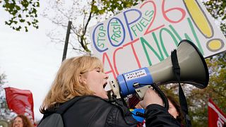 Climate activists march through the streets of Glasgow, Scotland, Friday, Nov. 5, 2021 