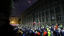 Protesters gather at the government building during a rally against mandatory vaccinations in Riga.