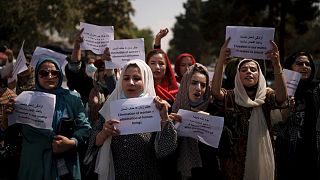 Afghan women march to demand their rights under the Taliban rule
