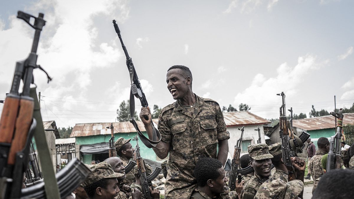 A soldier from the Ethiopian National Defence Forces (ENDF) gestures after finishing training in the field of Dabat, 70 kilometres northeast of the city of Gondar, Ethiopia, o