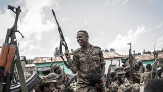 A soldier from the Ethiopian National Defence Forces (ENDF) gestures after finishing training in the field of Dabat, 70 kilometres northeast of the city of Gondar, Ethiopia, o