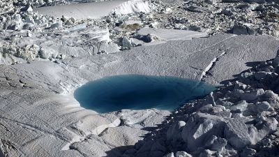 A large melt pool forms in the Ilulissat ice fjord below the Jakobshavn Glacier, at the fringe of the vast Greenland ice sheet. A large melt pool forms in the Ilulissat ice fjord below the Jakobshavn Glacier, at the fringe of the vast Greenland ice sheet.