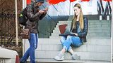 A man walks past an ads poster at an Internet devices shop in St.Petersburg, Russia