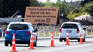 In this Oct. 16, 2020, file photo, cars are driven past a billboard urging voters to vote "No" against euthanasia in Christchurch, New Zealand.