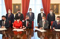 The parties signed the deal in the Czech Chamber of Deputies in Prague on Monday.
