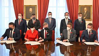 The parties signed the deal in the Czech Chamber of Deputies in Prague on Monday.