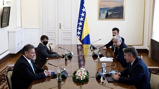 US Deputy Assistant Secretary of State Gabriel Escobar, left, speaks with the Croat member of the Bosnian Presidency Zeljko Komsic.