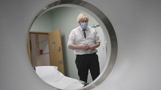 Britain's Prime Minister Boris Johnson is shown around a CT scan room during a visit to Hexham General Hospital in Northumberland, England, Monday, Nov. 8, 2021. 