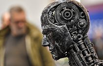 Nov. 29, 2019, file photo, a metal head made of motor parts symbolizes artificial intelligence, or AI, at the Essen Motor Show