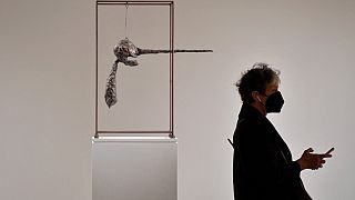 A person walks past Alberto Giacometti's "Le Nez", part of The Macklowe Collection, at Sotheby's on November 5, 2021 in New York City.
