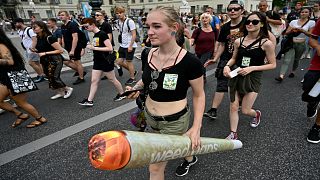 A participant holds an inflatable plastic joint during the 23rd Hanfparade, a traditional German-wide pro-Cannabis march in 2019