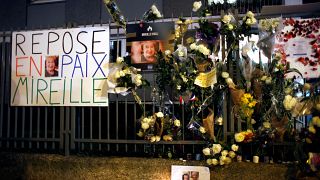 Tributes outside Mireille Knoll's apartment after her murder in 2018