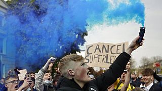 Chelsea fans protest against the proposed European Super League outside Stamford Bridge Stadium in London, April 2020