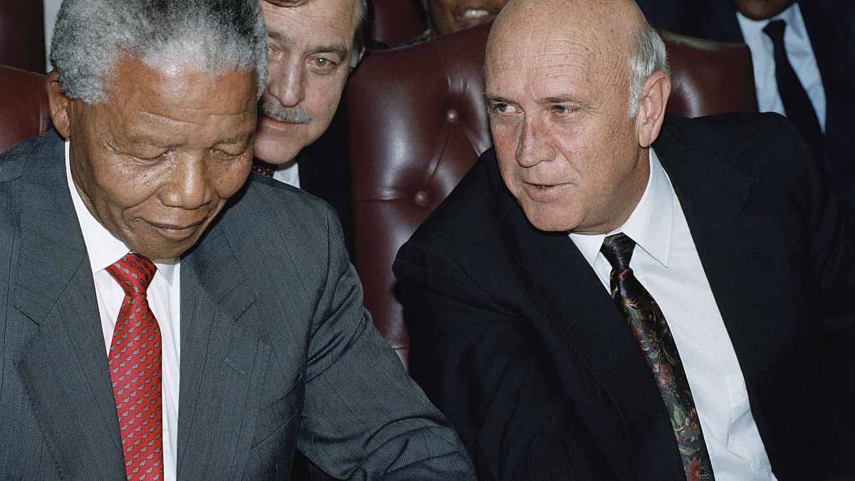 President F.W. de Klerk, right, has a word with African National Congress President Nelson Mandela, during a meeting in Gaborone, Botswana Jan. 27, 1994