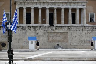 Municipal workers install Greek flags in front of the Greek parliament.