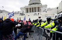 Trump supporters try to break through a police barrier at the Capitol on Jan. 6, 2021