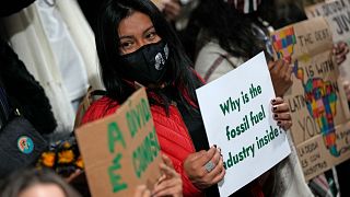 Youth climate activists protest that representatives of the fossil fuel industry have been allowed inside the venue during COP26 in Glasgow, Scotland, November 11, 2021. 