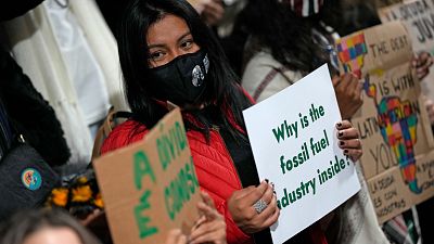 Youth climate activists protest that representatives of the fossil fuel industry have been allowed inside the venue during COP26 in Glasgow, Scotland, November 11, 2021. 