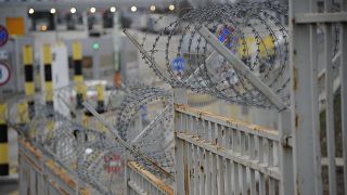 Barbed wire lines the Kapitan Andreevo border crossing point between Bulgaria and Turkey.